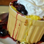 Sweet Cornbread Pudding with Berries and Whipped Cream